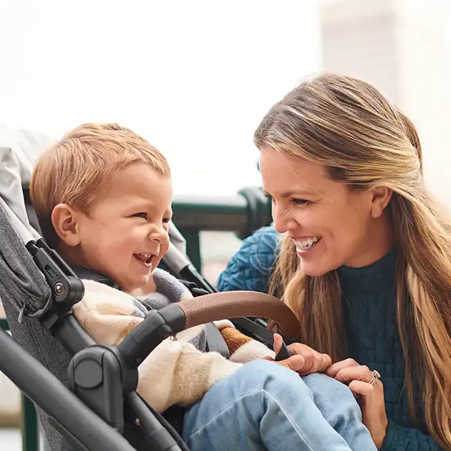 Mother looking at child in stroller