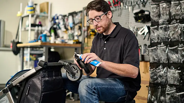 Service technician working on a stroller